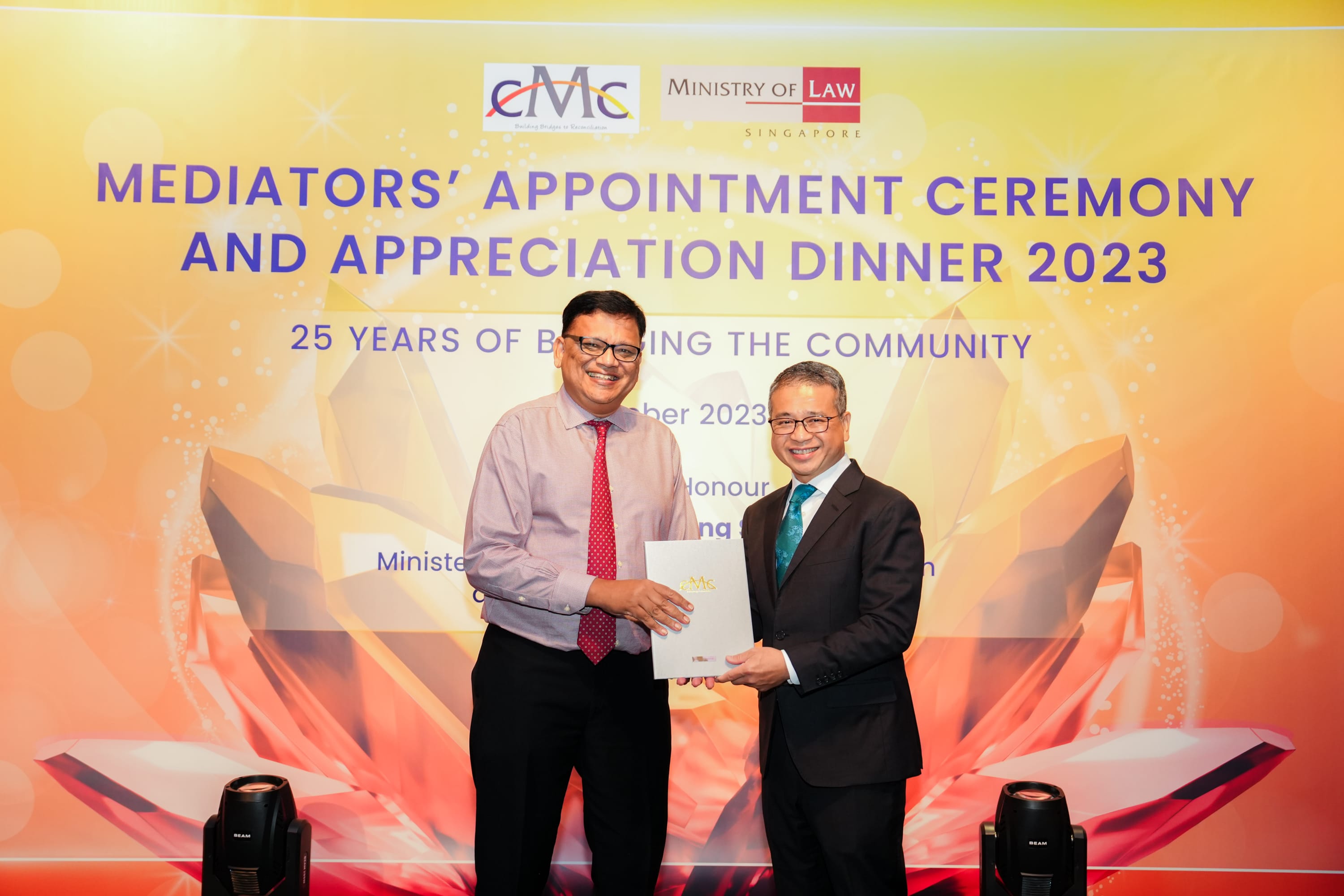 reappointment Image 3 award with Min Edwin